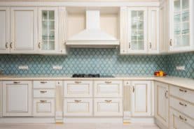 Newly remodeled kitchen with warm cream or off-white cabinets.